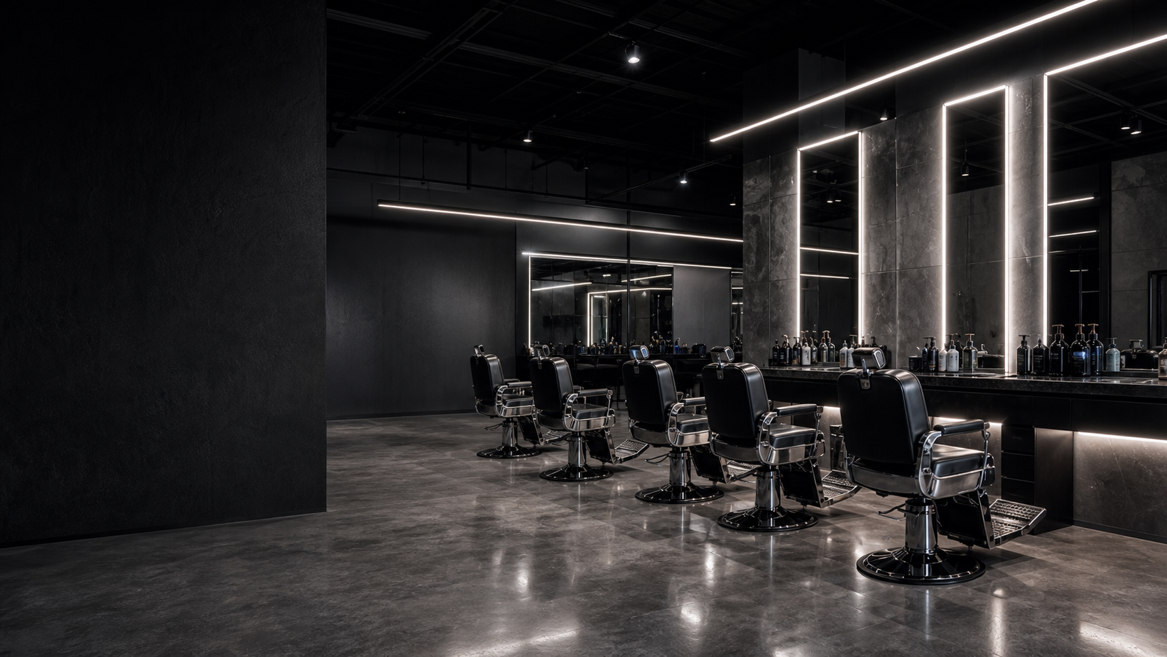 Fadeaway Barbers studio interior with black chairs and backlit mirrors